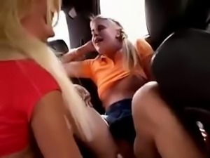 Two hot teen lesbians finger each other's pussies in the car