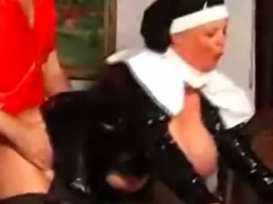 Horny mature nun in latex with slave