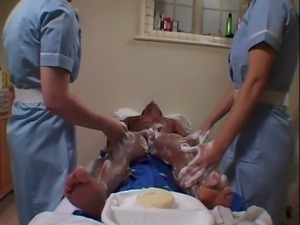 Naughty nurses give their patient a sexy bath