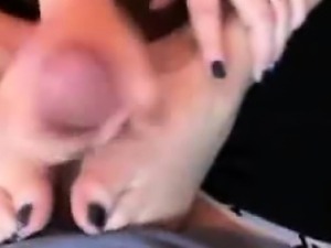 Busty wife gives footjob
