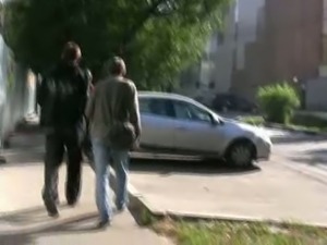 Russian brunette chick in black pants pisses on the sidewalk
