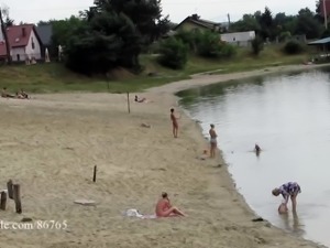 Ola walking alone naked on a public beach (voyeur version)