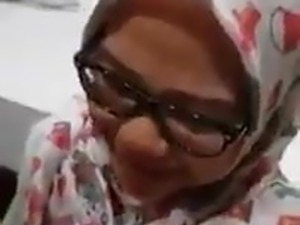 Girl wearing a hijab gets cum all over her face