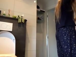 Buxom teen with a heavenly ass caught peeing on hidden cam