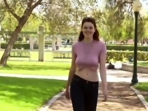 Bodacious babe flaunts her big natural tits in a public park