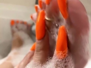 Hot amateur housewife caressing her sexy feet in the bathtub