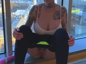 Busty bald alt bitch masturbates at the window with a pink vibrator!