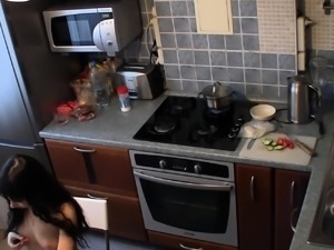 Filming nude girlfriend cooking in the kitchen
