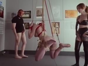 Busty blonde slave bound and hung for extreme BDSM sensations